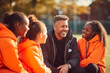 © Laura - Adults mentoring children in sports activities, with space for quotes on teamwork