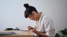 Positive artist sketching notebook at remote workplace closeup. Woman drawing