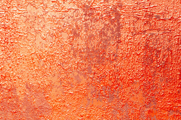 Wall Mural - Cracked rusty metal painted with red paint as an abstract background. Texture