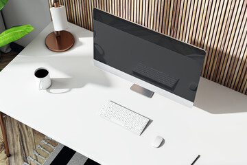 Wall Mural - Top view of modern designer office interior with computer monitor, reflections, coffee cup lamp and other items. Decorative wooden background. 3D Rendering.