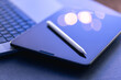 © puhimec - Digital tablet, stylus pen and laptop on the desktop, close up.