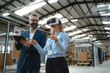 © Halfpoint - Engineers talking project using VR, in modern industrial factory. Virtual reality in manufacturing industry, Smart glasses guiding female and male manager through process and planing.