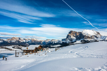 The largest high altitude plateau in Europe in winter. Snow and winter atmosphere on the Alpe di Siusi. Dolomites.