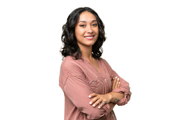 Wall Mural - Young Argentinian woman over isolated background with arms crossed and looking forward