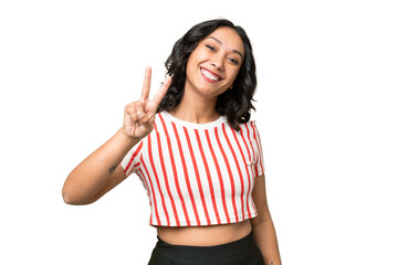 Wall Mural - Young Argentinian woman over isolated background smiling and showing victory sign