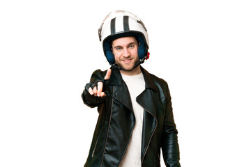 Wall Mural - Young handsome blonde man with a motorcycle helmet over isolated chroma key background showing and lifting a finger