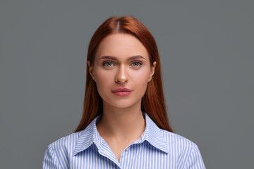 Poster - Portrait of beautiful young woman on grey background