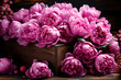 A bright bouquet of peonies in an old wooden box is a wonderful greeting on Valentine's Day or a wedding celebration.