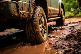 Fototapeta Łazienka - a truck is driving through a muddy road