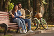 © New Africa - Beautiful couple spending time together in park, space for text
