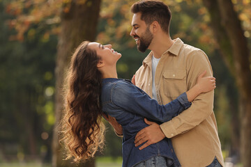 Sticker - Beautiful couple spending time together in autumn park