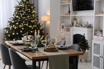 Wall Mural - Christmas table setting with festive decor and dishware in living room