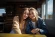 Two teenager girl friends in a house