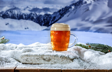 Wall Mural - Glassof cold beer and winter time. Landscape of mountains and empty space for your decoration. Christmas time. 