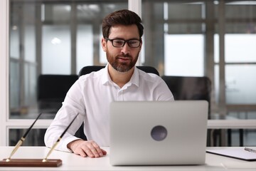 Wall Mural - Portrait of serious man in office. Lawyer, businessman, accountant or manager