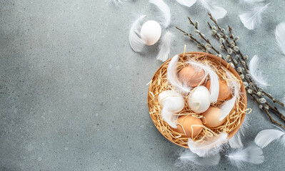 Wall Mural - easter willow branch and eggs on a blue background. happy easter holiday concept. place for text, to