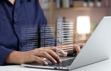 Canvas Print - Business performance monitoring and evaluation concept, Take an assessment, Business man using laptop and tablet online checklist survey, Filling out digital checklist, Questionnaire with checkboxes.
