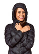 © Asier - Middle-aged woman in black down coat in studio