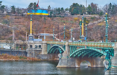 Canvas Print - Cech Bridge against Letna Hill and Prague Metronome, Czechia