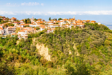 Wall Mural - travel to georgia - view of signagi town illuminated by sun on mountain in kakheti region of georgia