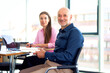 © gzorgz - Group of business people sitting in a modern office and working together