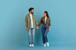 © Prostock-studio - Romantic millennial indian couple posing on blue studio background