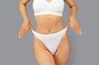 © Prostock-studio - Caucasian slim young woman in white underwear show perfect body after weight loss, cropped