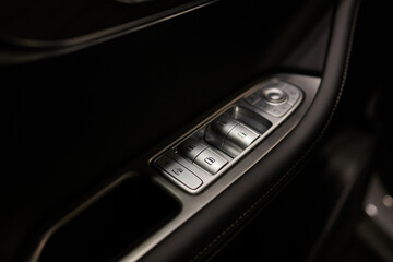 Sticker - Buttons to lock and unlock the locks on the driver's door of a new modern premium car