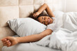 © Prostock-studio - Happy Black Lady Waking Up After Well Sleep In Bedroom