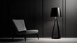 © Anna - a black lamp next to a white chair in a dark room with a black lamp shade on the floor and a white chair with a black lamp on the floor.