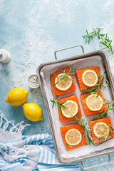 Poster - Salmon. Fresh raw salmon fish fillet with cooking ingredients, rosemary and lemon, top view