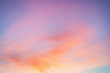 Wall Mural - Majestic dusk. Sunset sky twilight in the evening with colorful sunlight. Bright colors. Abstract nature background. Moody pink, purple, orange and yellow clouds sunset sky.