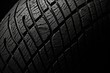A close up view of a tire on a black background. Suitable for automotive and transportation-related designs