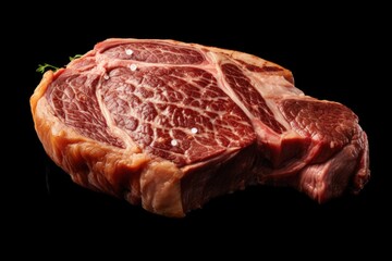 Poster - A piece of meat placed on a black surface. Suitable for food photography and cooking-related projects