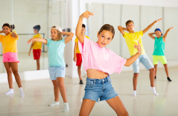 Wall Mural - Boys and girls dancing cool hip-hop dance during their rehearsal.