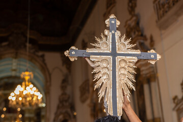 Wall Mural - Faithful enter the church of Senhor do Bonfim with the cross of Jesus Christ in the city of Salvador, Bahia.