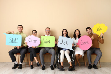 Sticker - Business people holding speech bubbles with words near beige wall