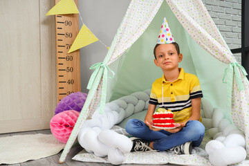 Sticker - Cute little boy with Birthday cake sitting in decorated room