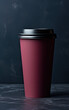 © Liana - A deep burgundy takeaway coffee cup against a dark background, emphasizing a sophisticated choice for the discerning coffee enthusiast.