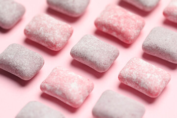 Canvas Print - Tasty colorful bubble gums on pink background, closeup