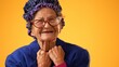 © Robert Peak - Closeup portrait of toothless elderly senior old woman with wrinkled skin having great happy success winner wearing US flag jacket isolated on yellow background. People emotions concept.