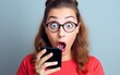 © piai - Surprised shocked young girl received a message on the phone
