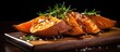 © AkuAku - Oven roasted sweet potato on rustic wooden surface.