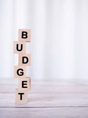 Wall Mural - Wooden blocks with the word BUDGET. The concept about budget planning and allocation