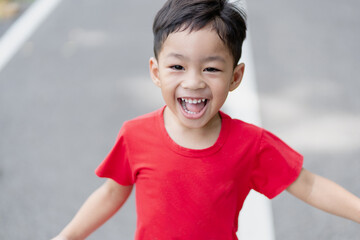 Asian children happy in the summer ,he smile and laugh