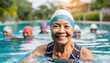 Smiling senior American woman in swim cap enjoys group swimming in sunny outdoor pool 