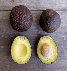 Wall Mural - Fresh avocado fruit on table wood background