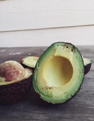 Poster - Fresh avocado fruit on table wood background