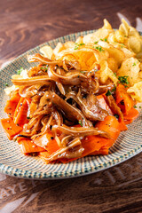 Poster -  appetizer pig pork ears with potato chips and carrot