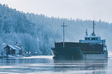 River Transport with a Large Ship Carrying Freight on the Water